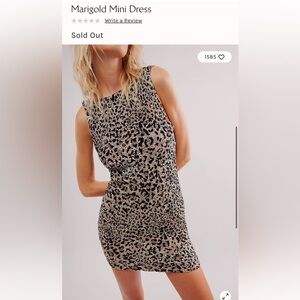 Free people Marigold mini dress size small bohemian festival leopard cheetah 90s